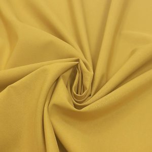 پارچه داکرون ساده رنگ کهربایی